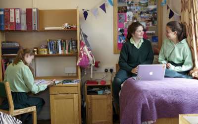 Why is it not recommended to live with a host family?